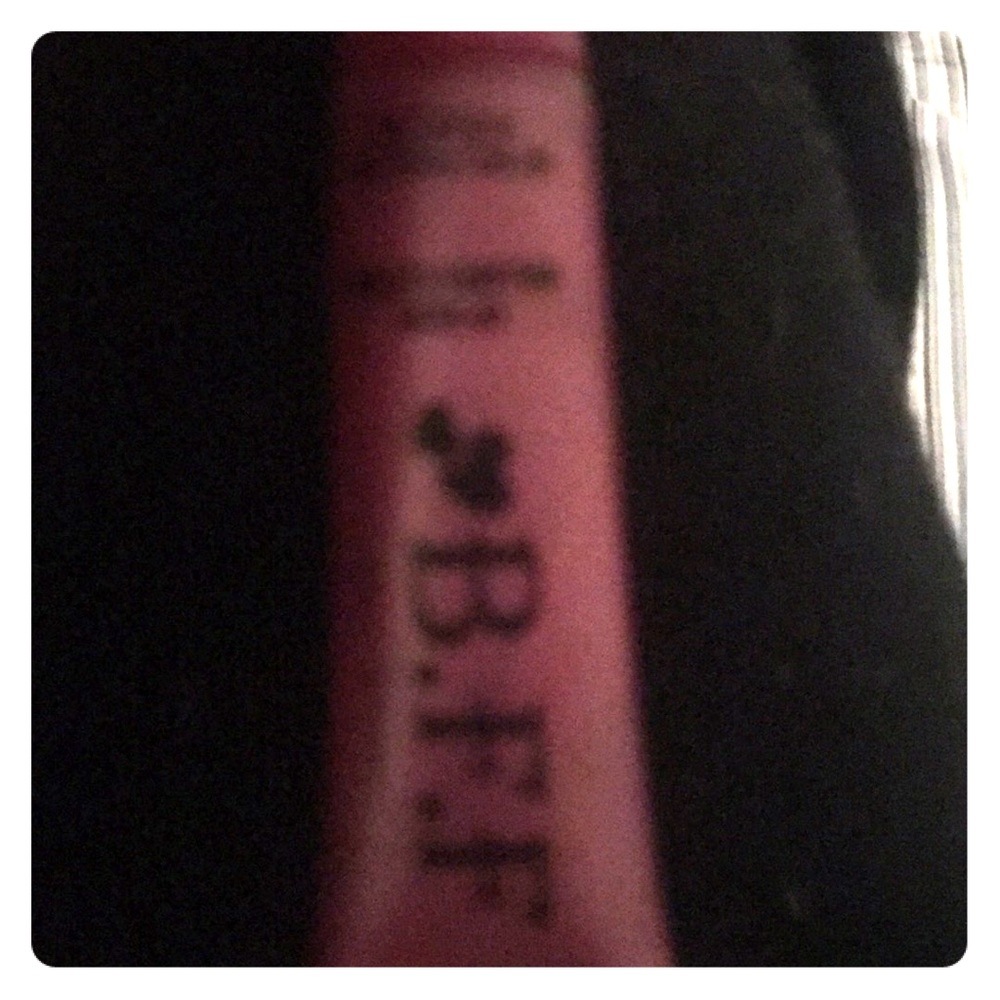 A pink red apple blossom lips gloss